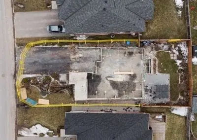 An aerial photo showing yellow temporary fence rentals surrounding a construction site.