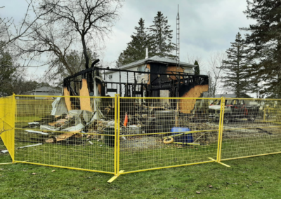 Temporary fence rental around damaged building, Ontario. Secure fencing solutions and privacy fence panels available.